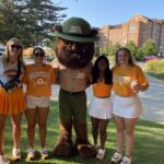 Tailgaters gather around Trashsquatch who wants us to have a cleaner Tennessee.